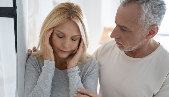 Man helping his wife
